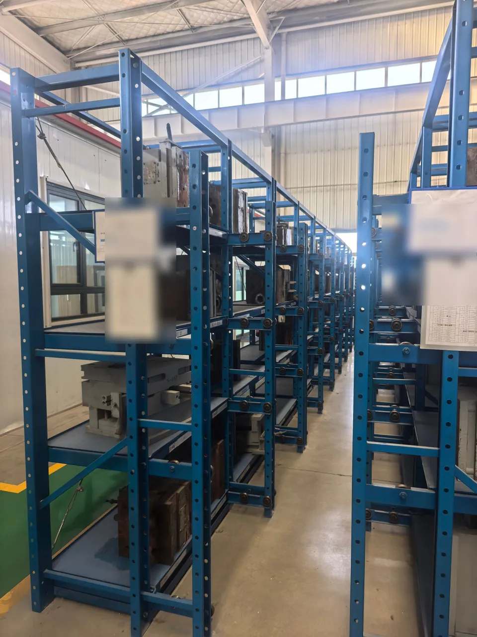 An aisle between rows of tooling storage racks